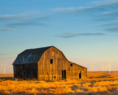 Wind turbines near a farmhouse